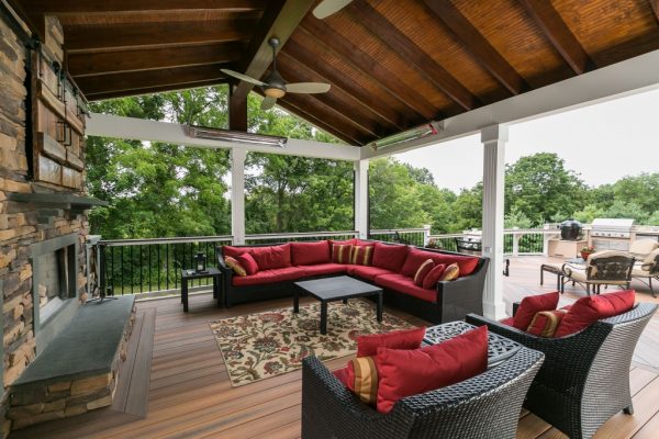 Deck Covering: A roof is an ideal way to trap heat when it’s cold; plus a fireplace not only adds warmth, but it provides a lot of ambiance. Photo: Fiberon Decking and Railing