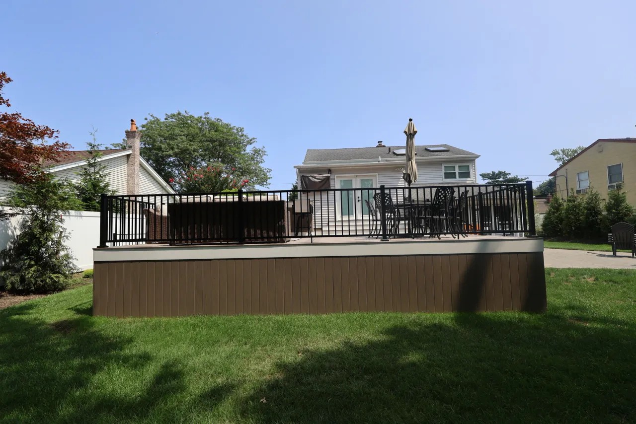 Bar-height counter seating beside the outdoor kitchen and grill