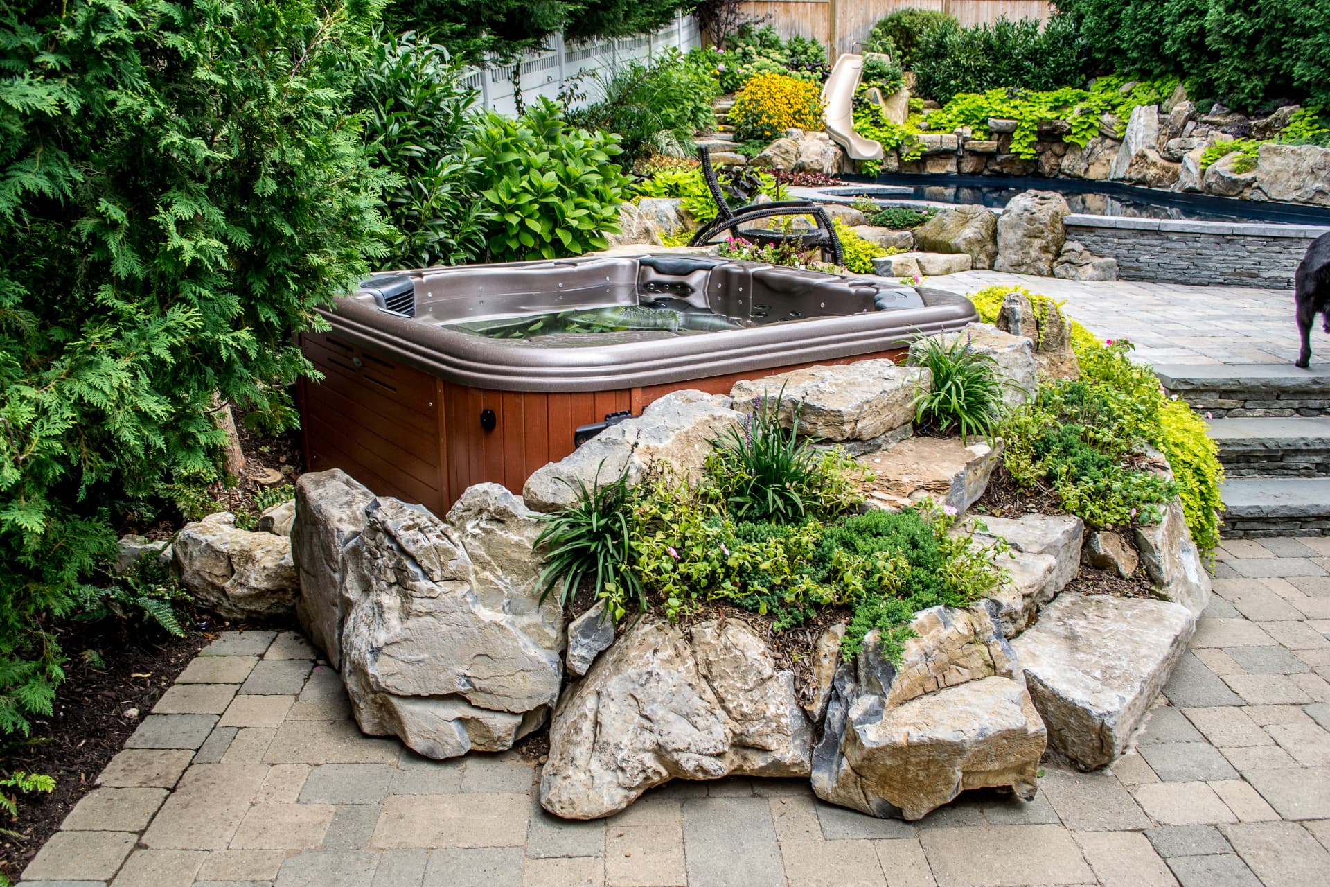 Hot tub set into a stone surround