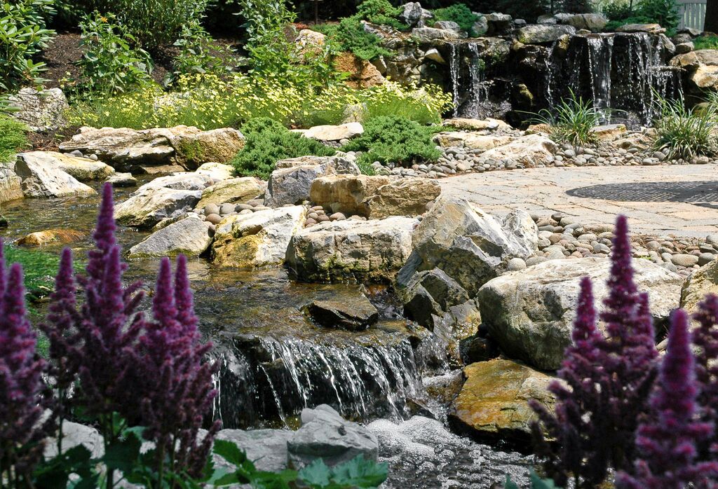 Rainwater Harvesting (Long Island/NY): The Aquascape ‘green’ RainExchange process combines a decorative water feature with a completely sub-surface collection system -- thereby creating a beautiful backyard oasis that is very eco-friendly.
