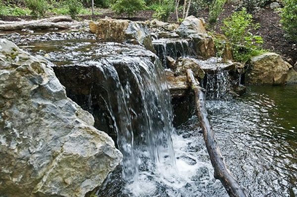 Pond Waterfall (Long island/NY): Our designers incorporated a 12’ waterfall with a 20,000 gallon-per-hour water flow. This helps keep the pond fresh and aerated with oxygen. 