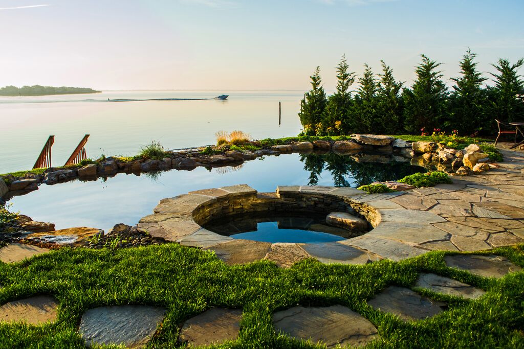 Natural-Looking Pool Design: Best of Both Worlds – The Deck and Patio  Company