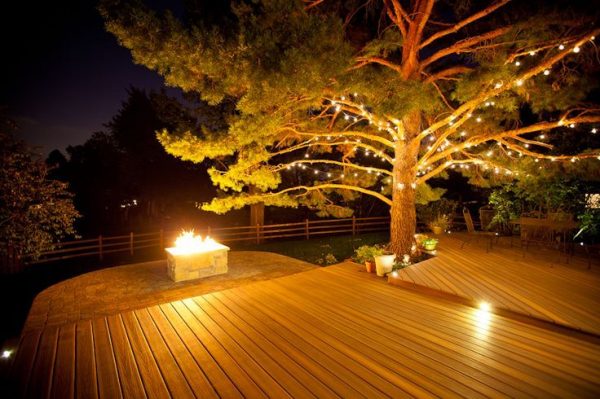She also suggests the addition of lights for a cozy winter atmosphere. “If you don’t have any deck lights built into the railing, just add Christmas/holiday lights, or snowflake lights along the railing, pergola, shrubs/planters, or even on a deck umbrella.”